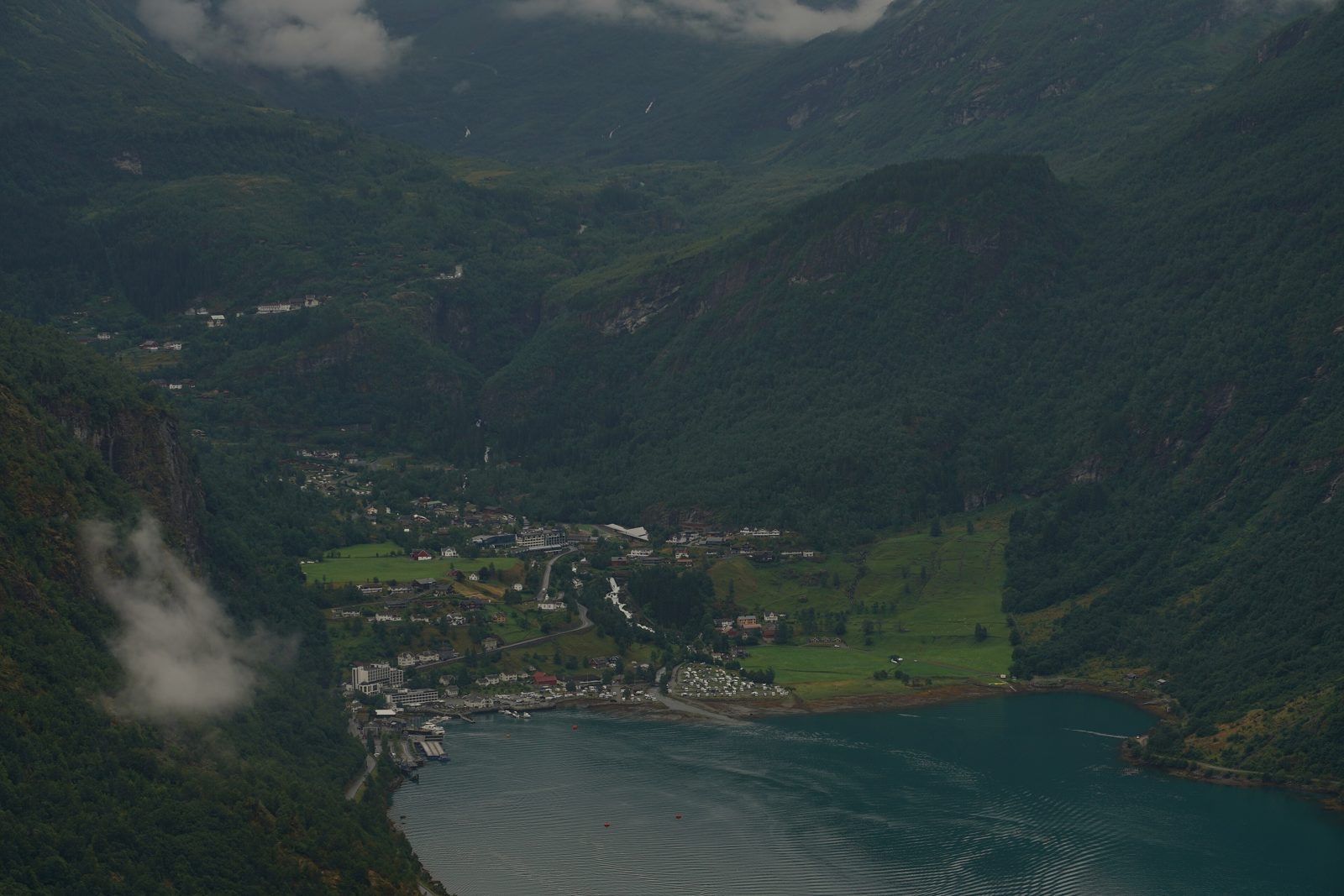 Steep green mountains surrounding Geirangerfjord, Norway